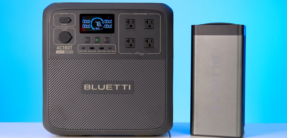 a closeup photograph of the Bluetti Pioneer MD with an extra B70 battery next to it