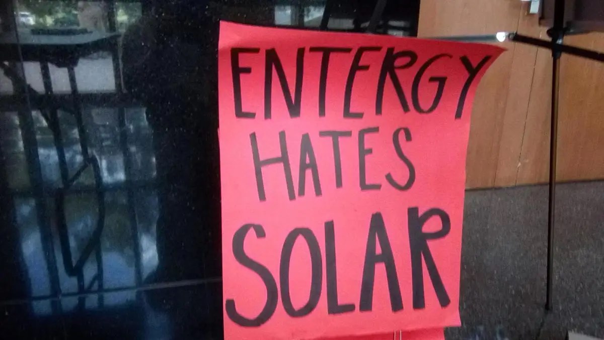 A handwritten sign that reads "Entergy hates solar"