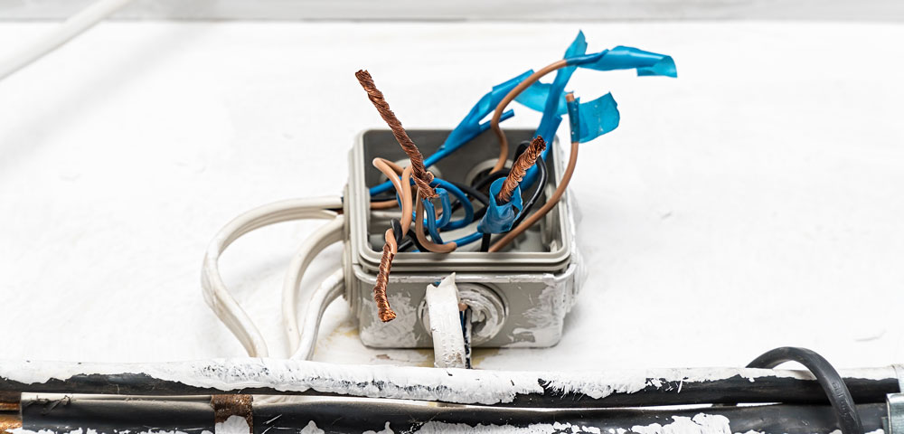 A photo of a poorly-wired junction box
