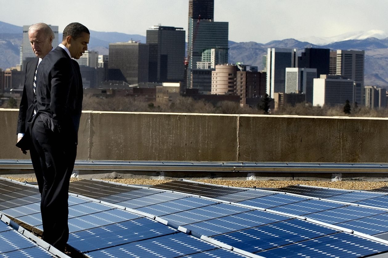 A photo of then-President Obama and VP Joe Biden on a rooftop with solar panels