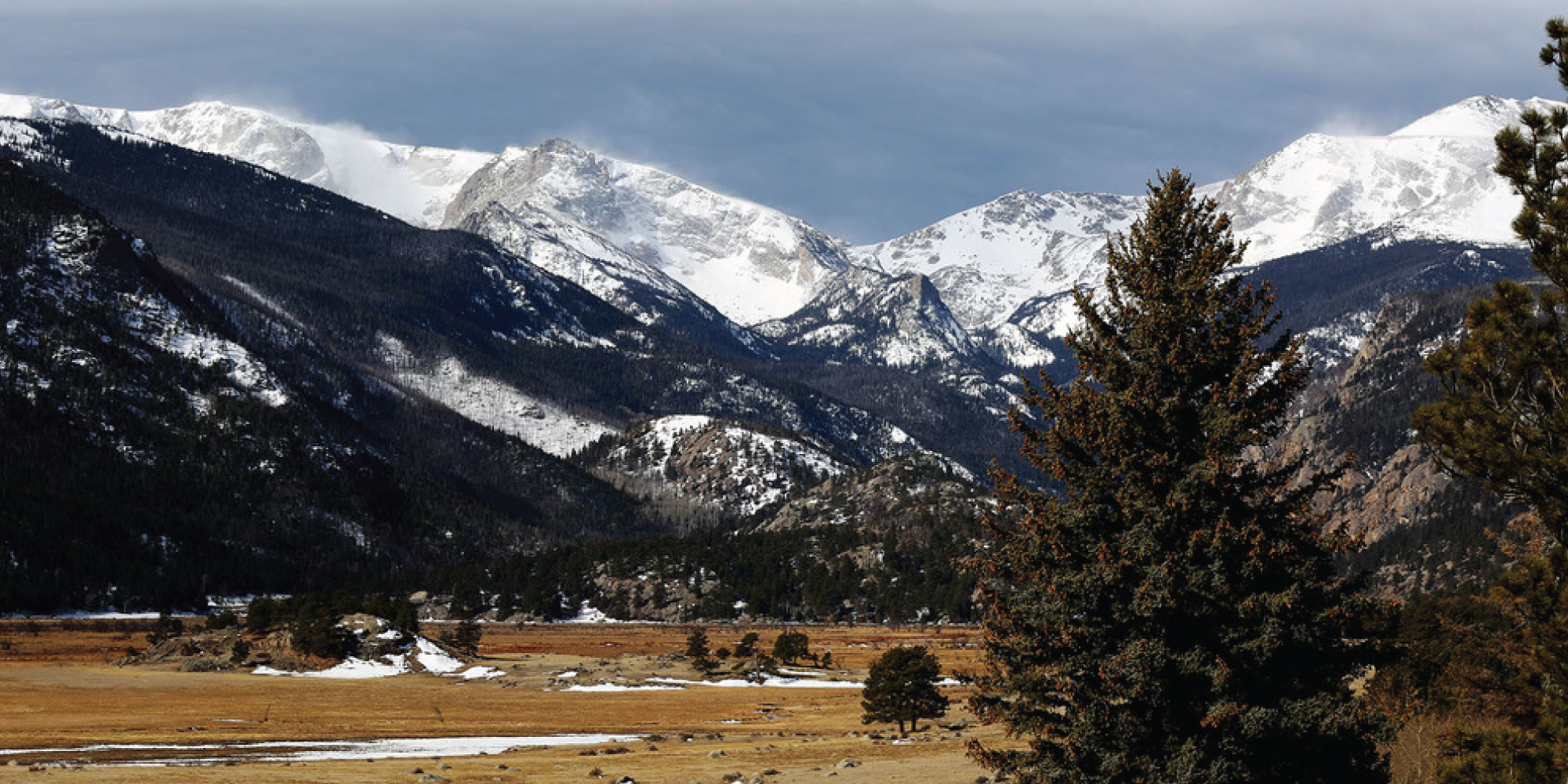 The Rocky Mountains with snow on the peaks.