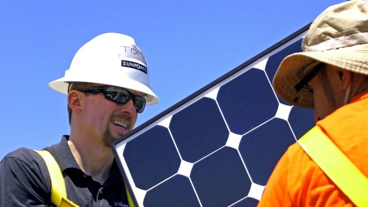 The SunPower CEO helping with a solar installation